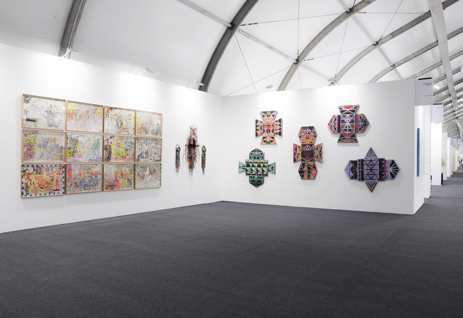 Art Central Hong Kong 2017 corner booth with dense grid hang and sculptural pieces